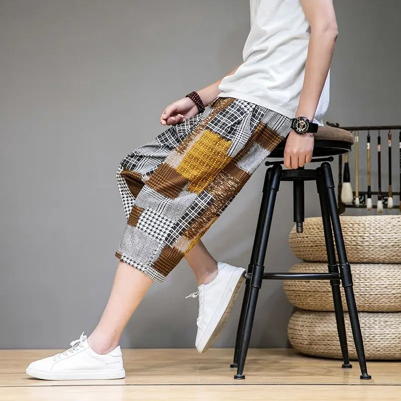 Bold patchwork capris shorts for unisex. Unique, trendy streetwear design, ideal for casual summer outfits.