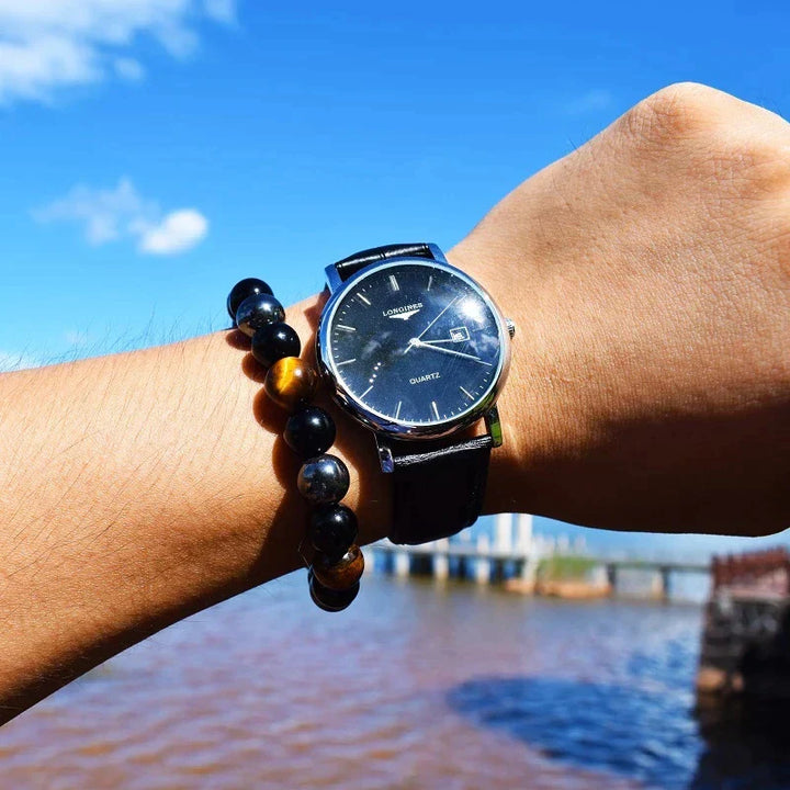 Adjustable unisex healing bracelet made with obsidian, hematite, and tiger eye gemstones.