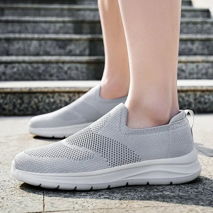 Casual unisex slip-on sneakers, ultra comfort knit material, lightweight for everyday walks.