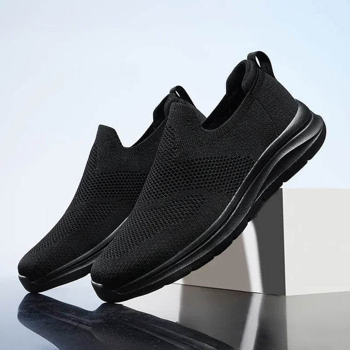 Breathable knit slip-on sneakers for men & women, offering ultimate walking comfort.