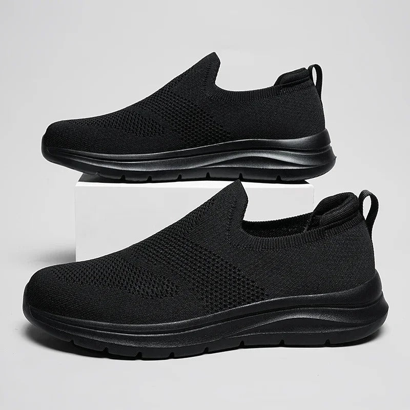 Lightweight laceless walking shoes with an ultra-comfortable knit design, unisex style.
