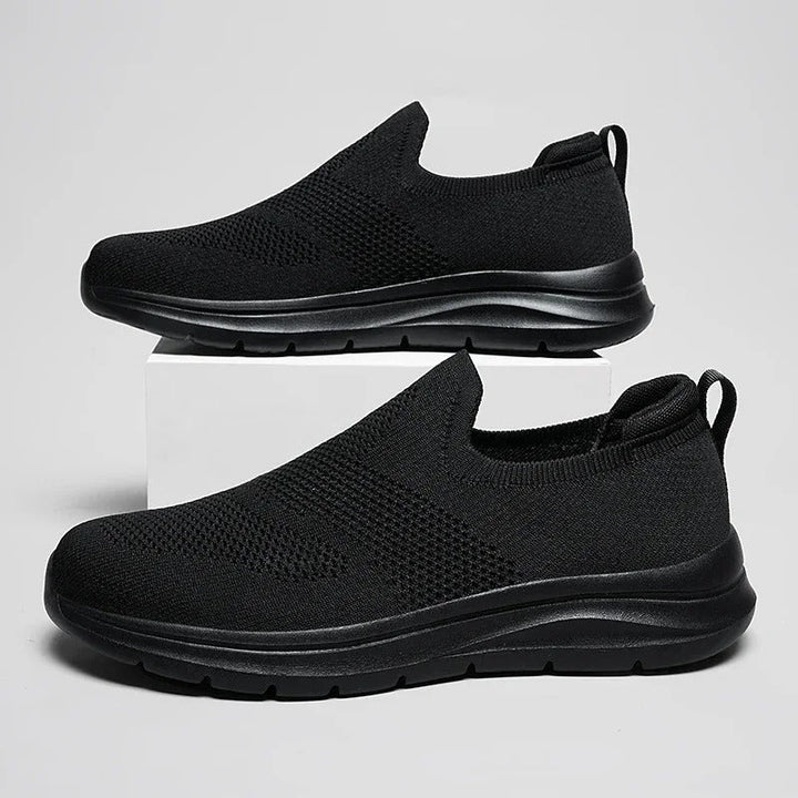 Lightweight laceless walking shoes with an ultra-comfortable knit design, unisex style.