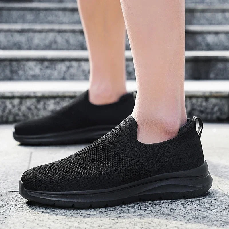 Comfortable slip-on walking sneakers for all genders, featuring a soft, breathable knit.