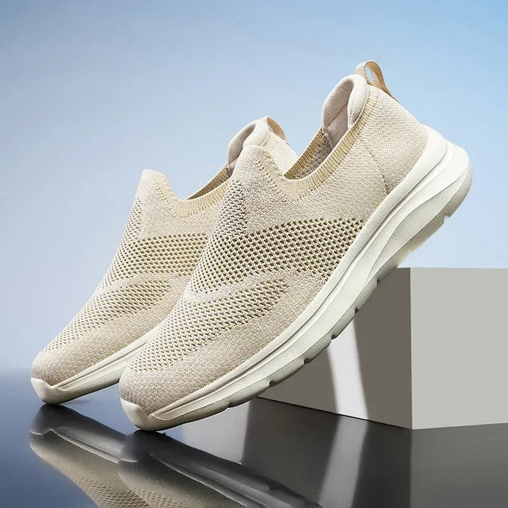 Knit slip-on shoes, lightweight & breathable, designed for active walking & casual comfort.