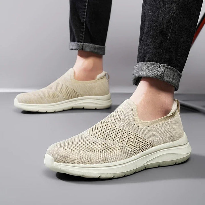 Ultra comfort walking sneakers, laceless knit design, breathable & lightweight for unisex use.