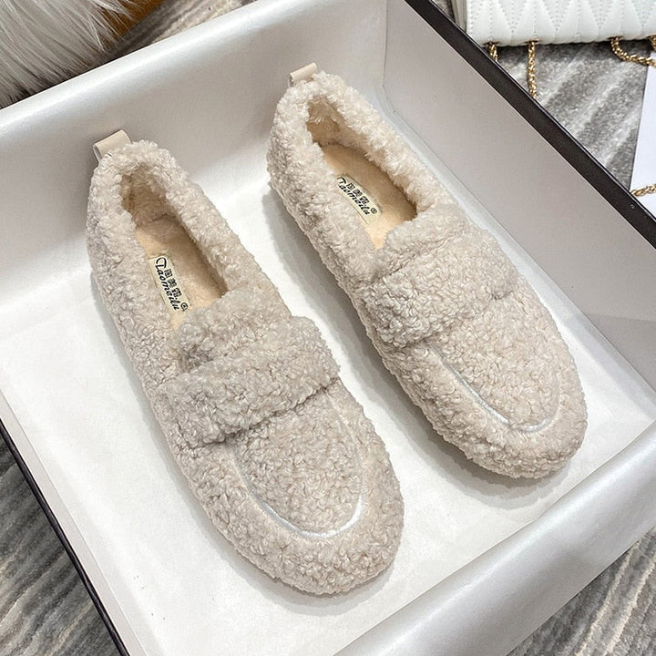 Warm and cozy unisex winter slippers for indoor comfort, perfect cold weather footwear.