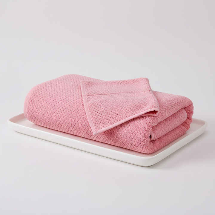 Quick-dry microfiber bath towel draped on a rack, emphasizing its easy care features