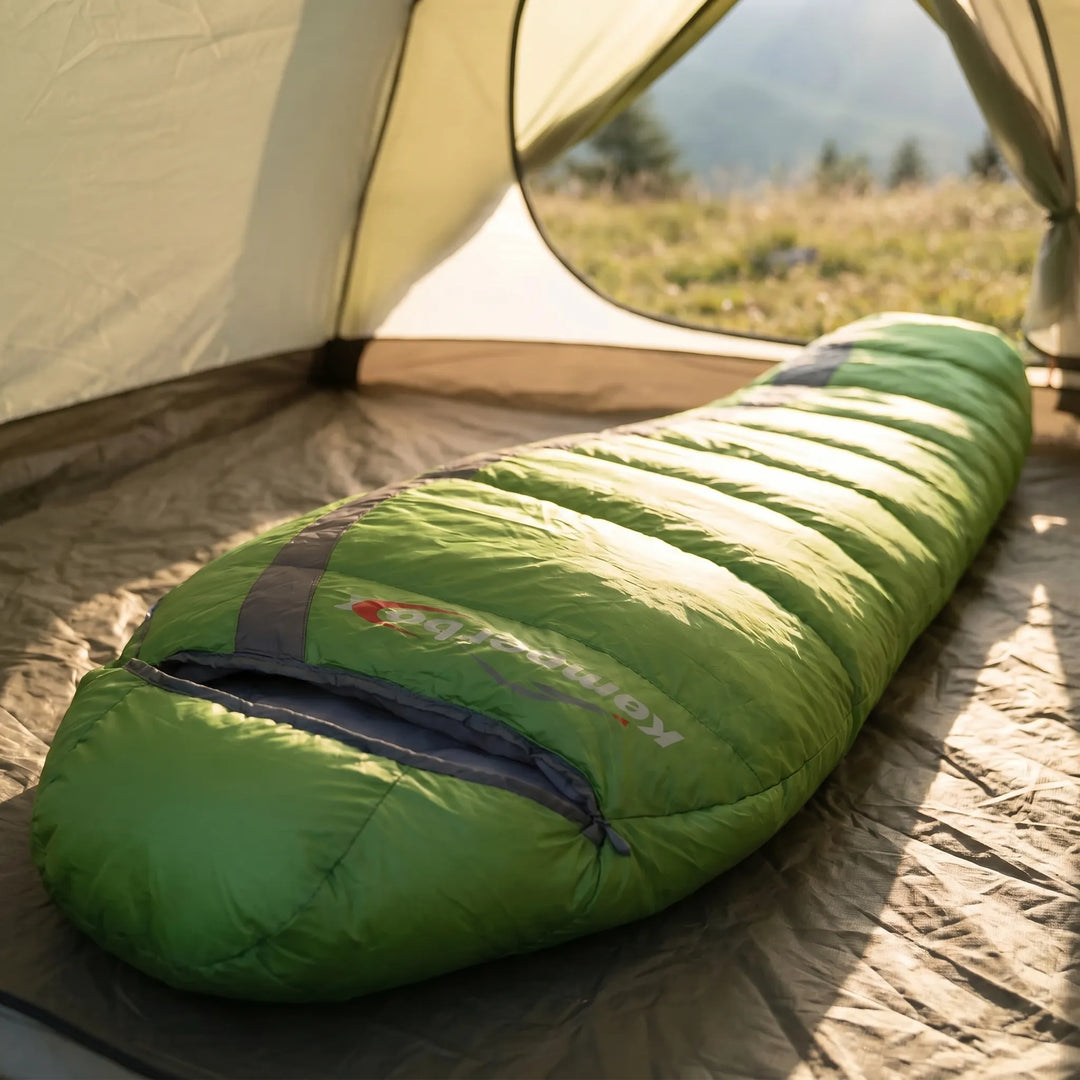 Ultralight down mummy bag, unisex, for cold weather camping. Essential thermal gear for outdoor adventurers.