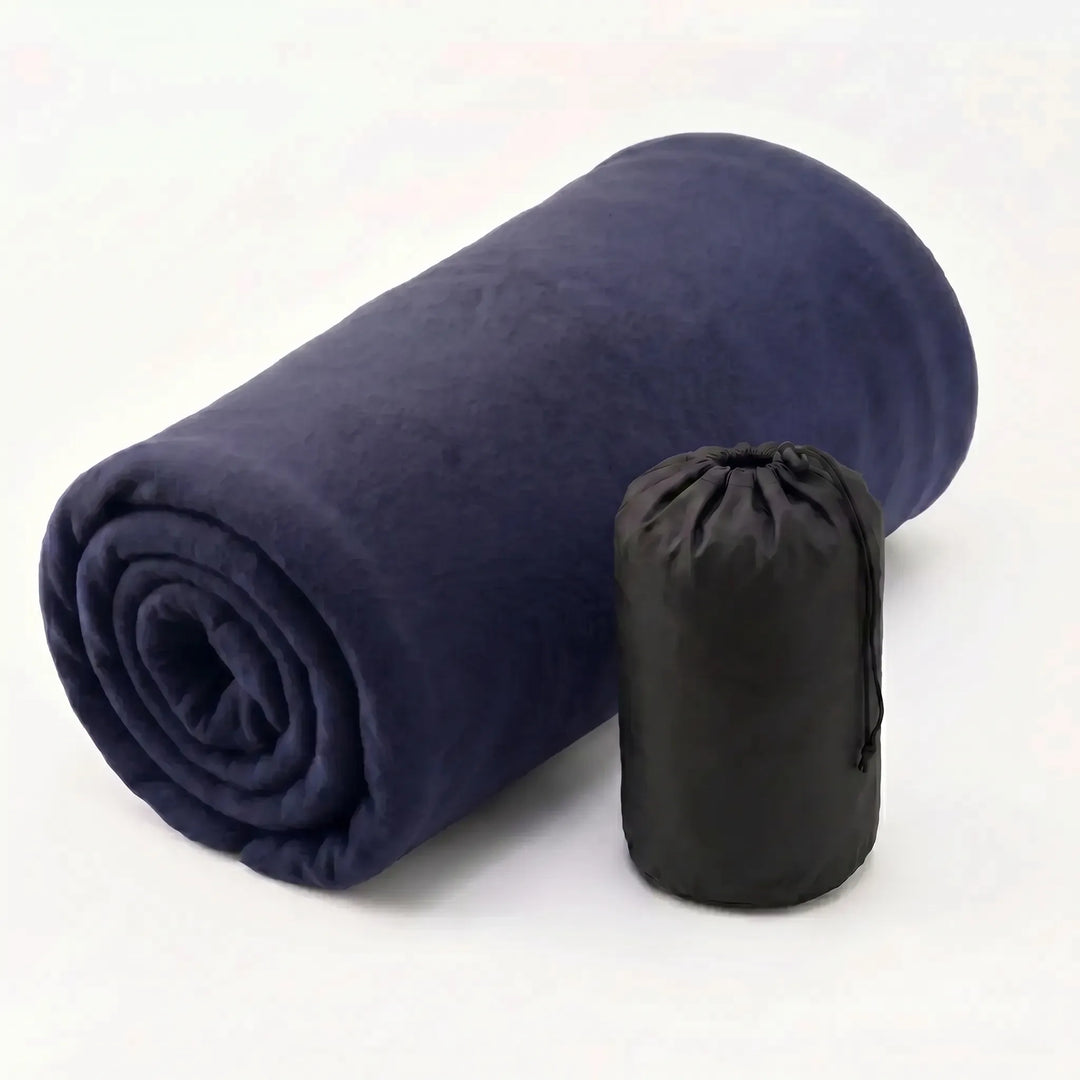 Rolled ultralight fleece sleeping bag liner with compression strap. Portable, compact outdoor camping gear.