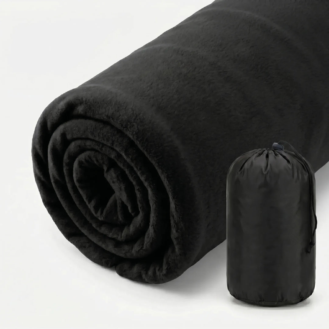 Unpacking ultralight fleece sleeping bag liner, ready for camping, hiking, or travel. Cozy & hygienic outdoor gear.