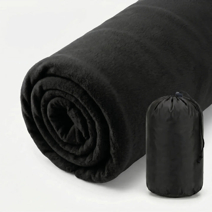 Unpacking ultralight fleece sleeping bag liner, ready for camping, hiking, or travel. Cozy & hygienic outdoor gear.
