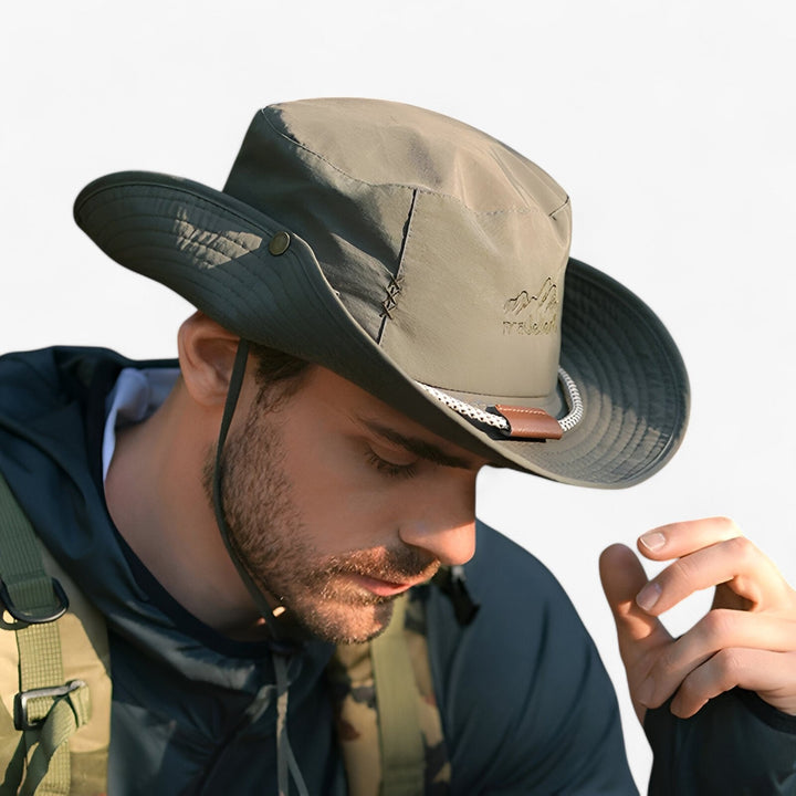 Unisex UPF 50+ waterproof bucket hat, perfect for sun protection during outdoor activities like hiking and fishing.
