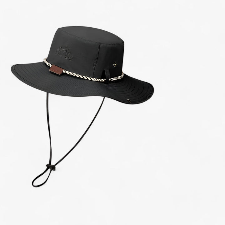 Waterproof travel bucket hat with UV protection, designed for both men and women, featuring a wide brim.