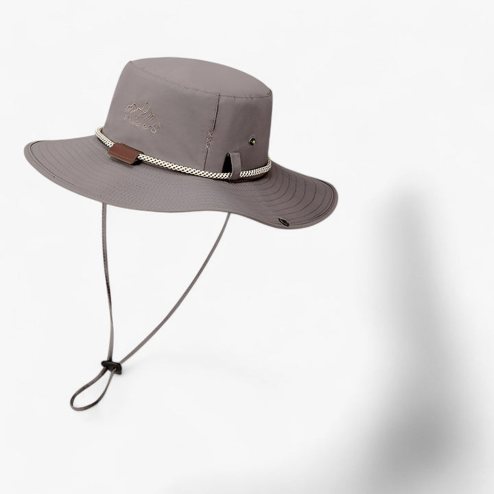 Outdoor headwear: Johnny unisex waterproof bucket hat in a natural setting, showing its versatility and comfort.