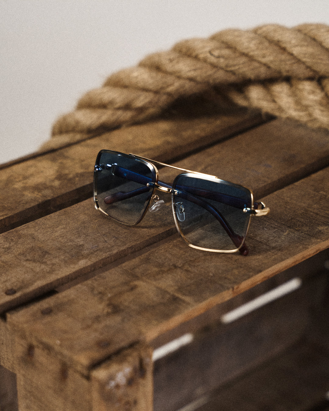 Detailed view of the unique woodgrain arms on unisex urban square sunglasses.