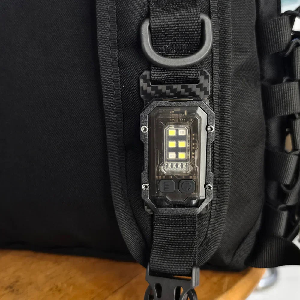 Compact USB rechargeable LED tactical flashlight with magnetic base for hands-free convenience.