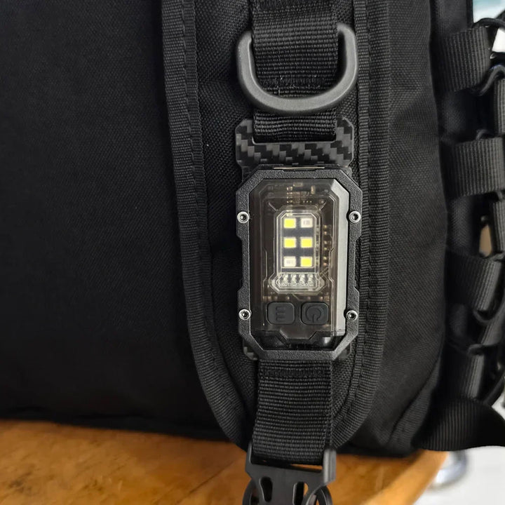Compact USB rechargeable LED tactical flashlight with magnetic base for hands-free convenience.