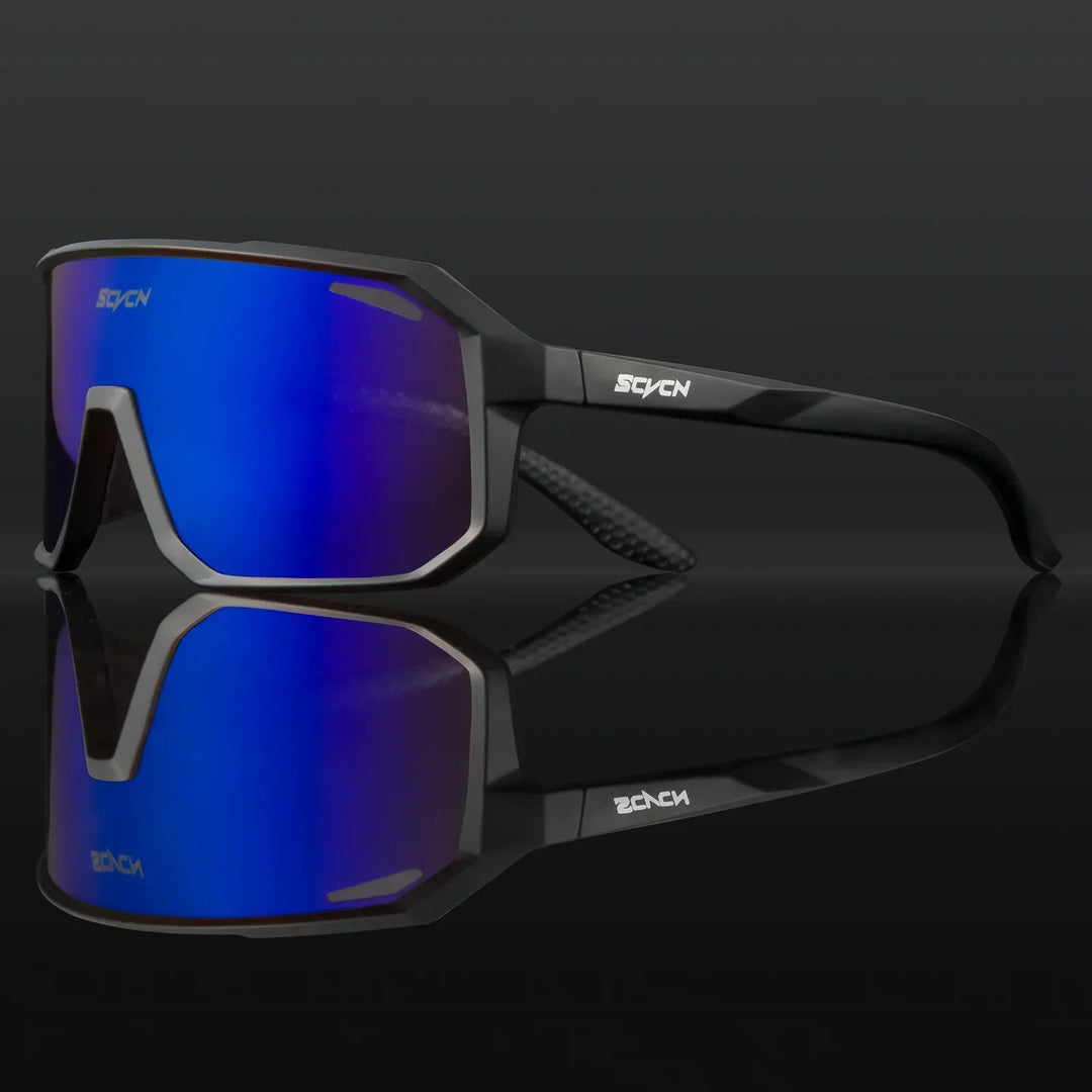 Cyclist wearing UV400 protective sunglasses during a mountain bike ride.