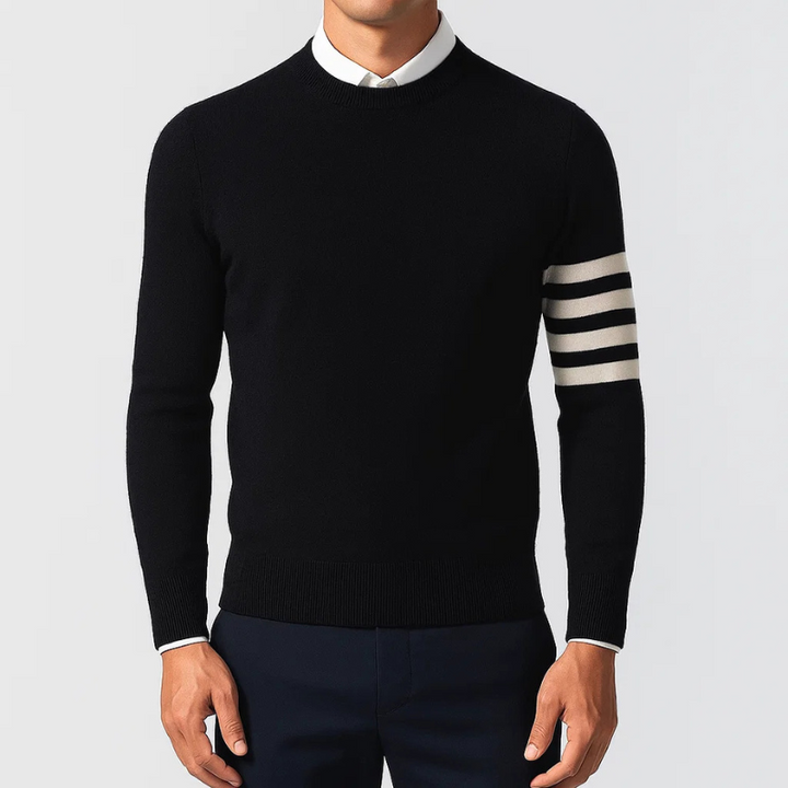 Textured knit pullover in varsity style, designed for unisex wear. Features comfortable knit and striped sleeves.