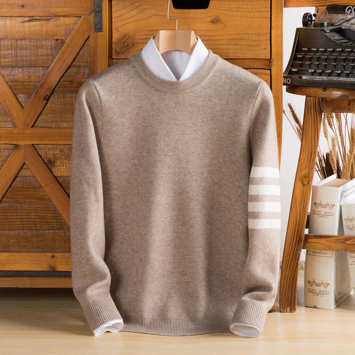 Sporty varsity knit pullover with striped sleeves, a comfortable unisex sweater. Great for casual winter fashion.