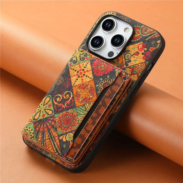 Stylish unisex phone cover: intricate botanical floral pattern on vegan leather iPhone case with card slots.