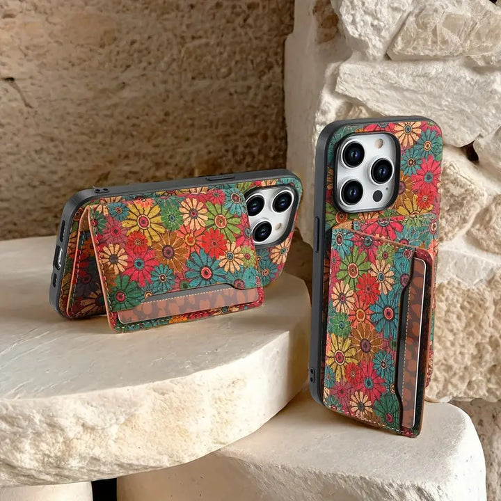 Shockproof iPhone wallet case with unique botanical floral design, built-in card holder & kickstand feature.