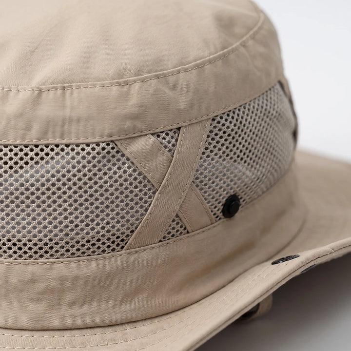 Lightweight unisex bucket hat with breathable mesh, designed for summer outdoor adventures & sun safety.