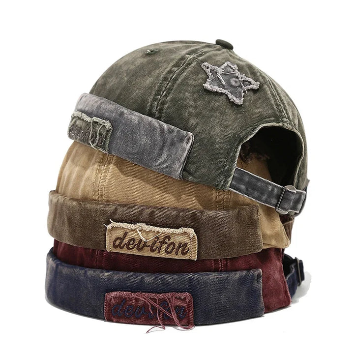 Unisex vintage distressed baseball cap with star patch detail.