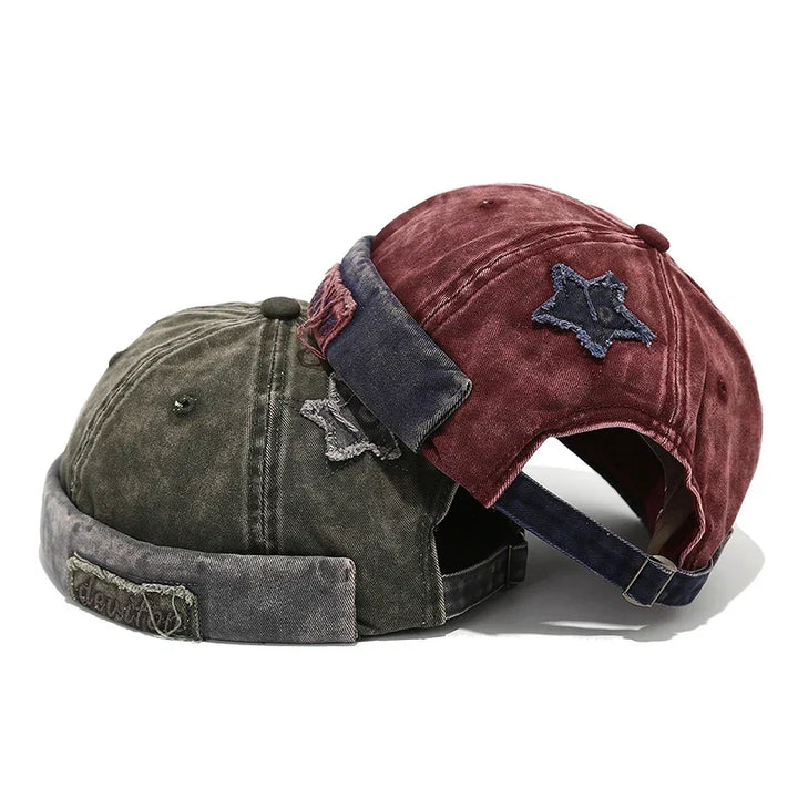 Adjustable cotton unisex distressed baseball cap featuring a star patch.