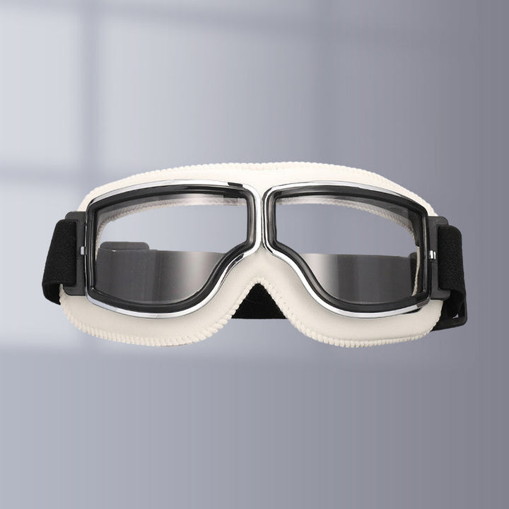 Vintage-style motorcycle goggles with clear lenses, perfect for night riding & protection.