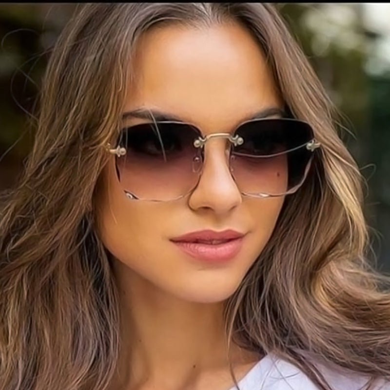 Unisex vintage rimless sunglasses with square frame, trendy design & UV400 protection. Lightweight eyewear.