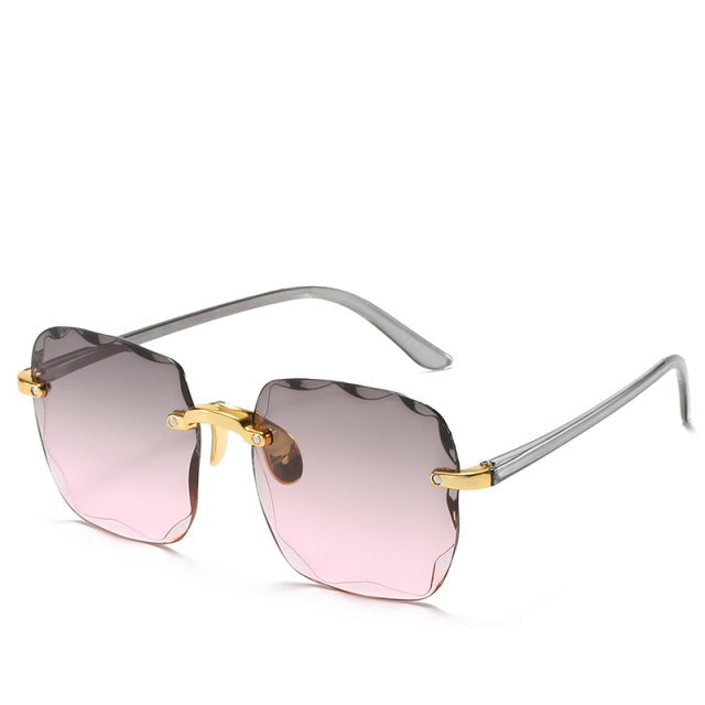 Fashionable unisex vintage rimless eyewear. These trendy sunglasses feature UV400 protection for stylish men & women.