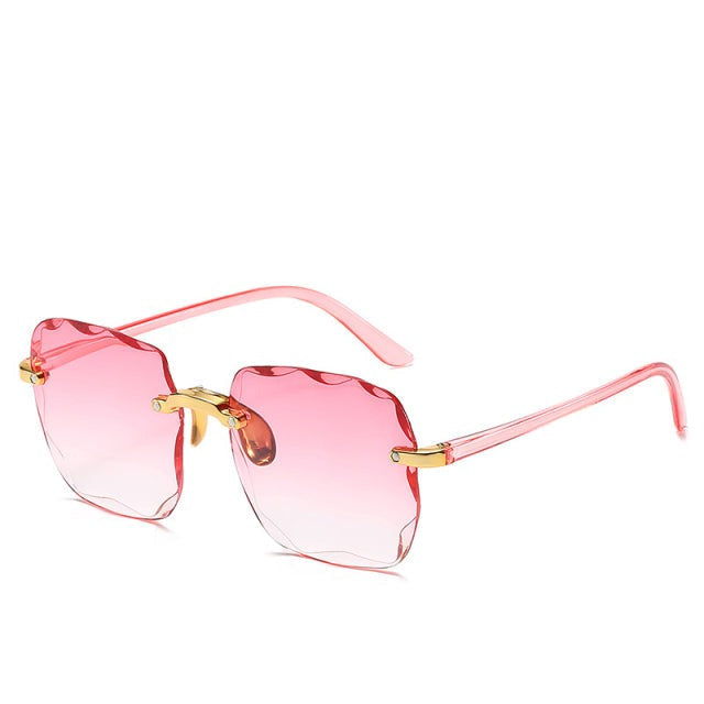 Protect your eyes with these trendy vintage rimless sunglasses. Unisex design, square frame & full UV400 protection.