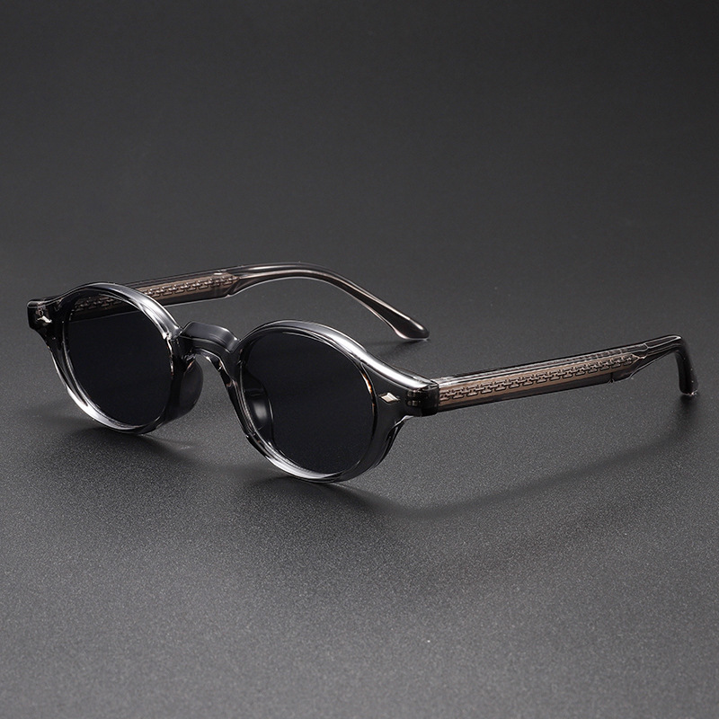 Unisex vintage sculpted oval sunglasses with an acetate frame & UV400 lenses for stylish eye protection.