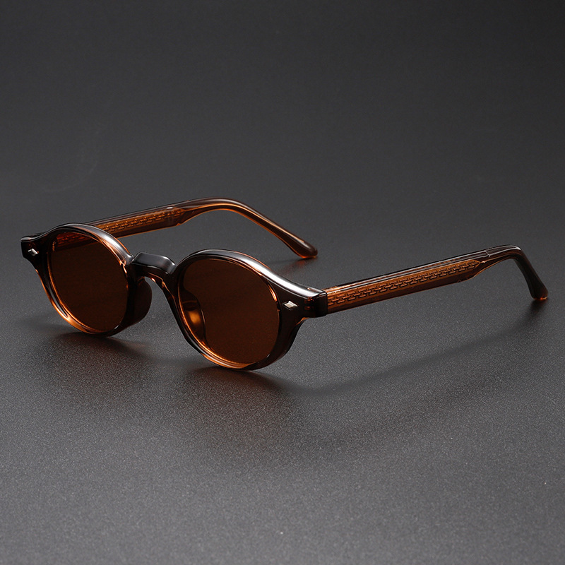 Fashionable unisex sculpted oval sunglasses featuring UV400 lenses & a distinct vintage design for eye protection.