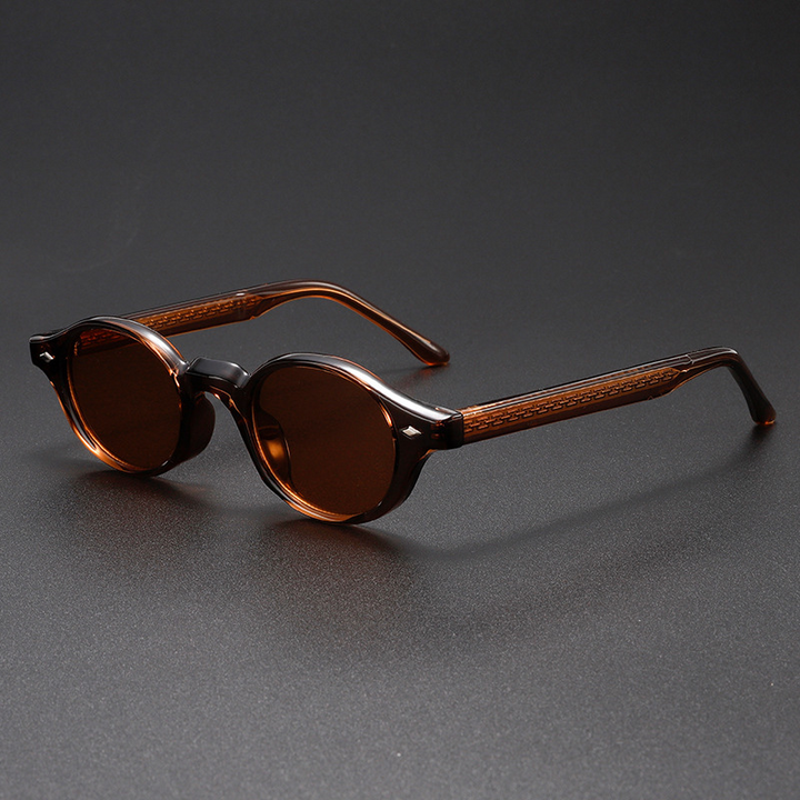 Fashionable unisex sculpted oval sunglasses featuring UV400 lenses & a distinct vintage design for eye protection.