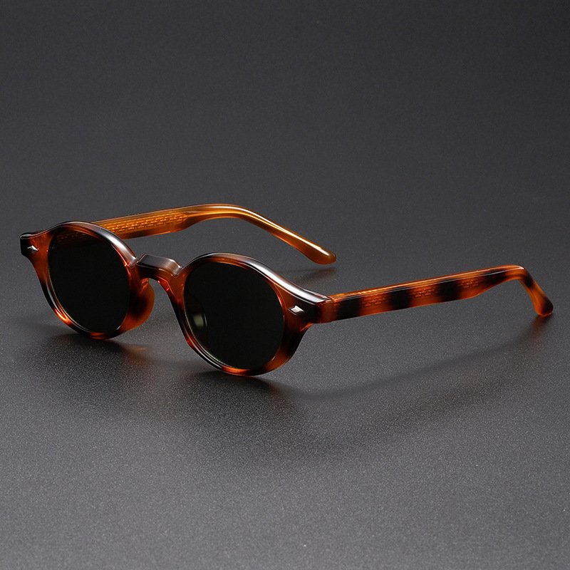 Unique sculpted oval vintage sunglasses, unisex design with durable acetate frame & UV400 lenses for eye protection.