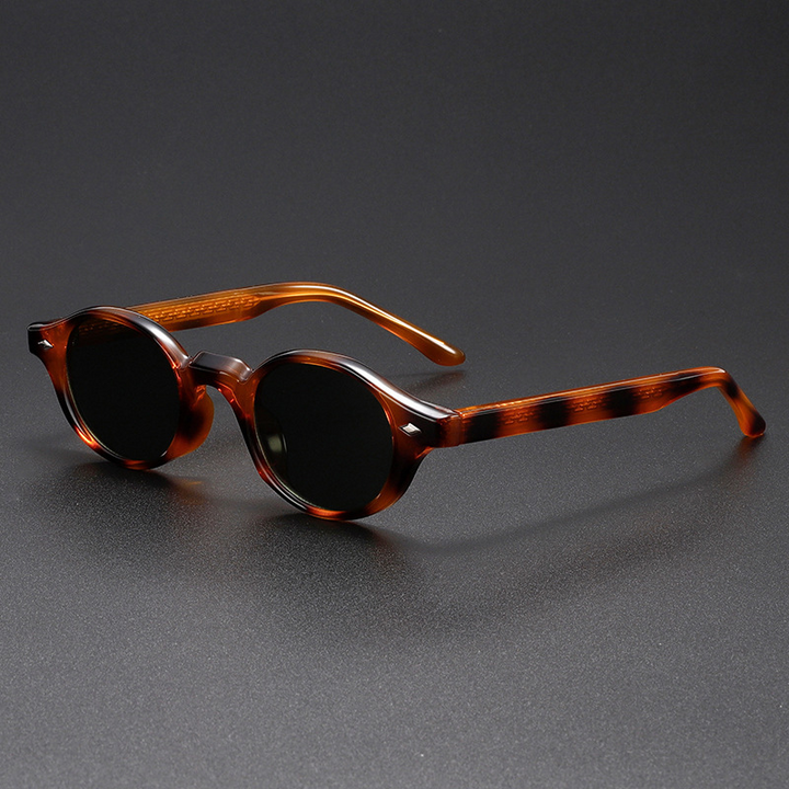 Unique sculpted oval vintage sunglasses, unisex design with durable acetate frame & UV400 lenses for eye protection.