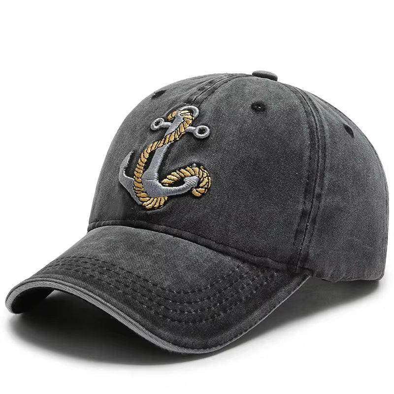 Unisex vintage washed baseball cap with embroidered anchor patch. Adjustable cotton hat for casual wear.