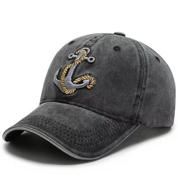 Unisex vintage washed baseball cap with embroidered anchor patch. Adjustable cotton hat for casual wear.