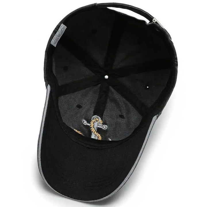 Unisex vintage washed baseball cap. Features an embroidered anchor patch. Adjustable cotton hat for everyday casual wear.