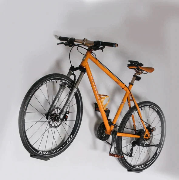 Space-saving wall-mounted bike hanger for efficient bicycle storage, ideal for homes, apartments, garages.