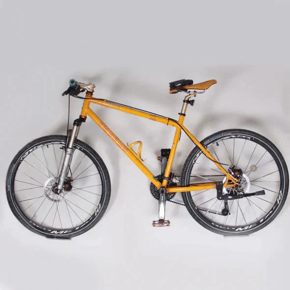 Practical bike accessory: space-saving wall mount bicycle hanger for garage organization & tidy storage.