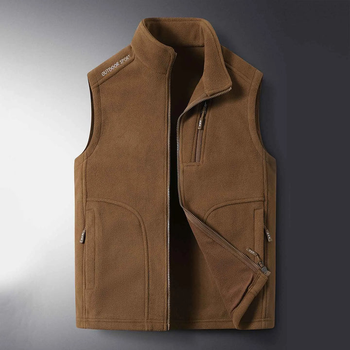 Stay warm outdoors with this unisex fleece vest. Lightweight, insulated, and perfect for hiking & layering.