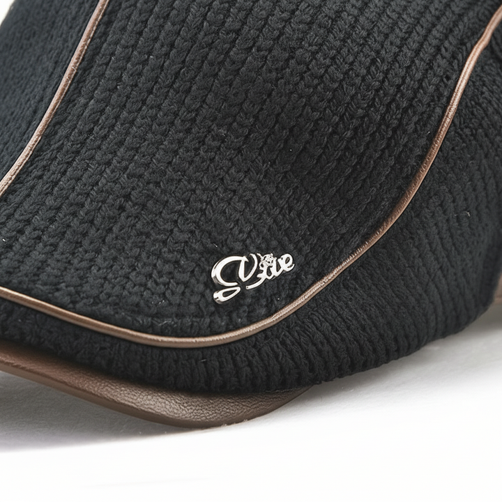 Close-up of a cozy, elastic knitted beanie hat, suitable for autumn and winter headwear.