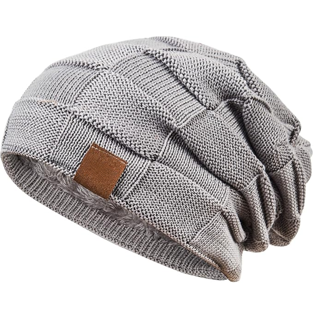 Accessory shot of a folded knitted beanie, ready for travel or everyday use in winter
