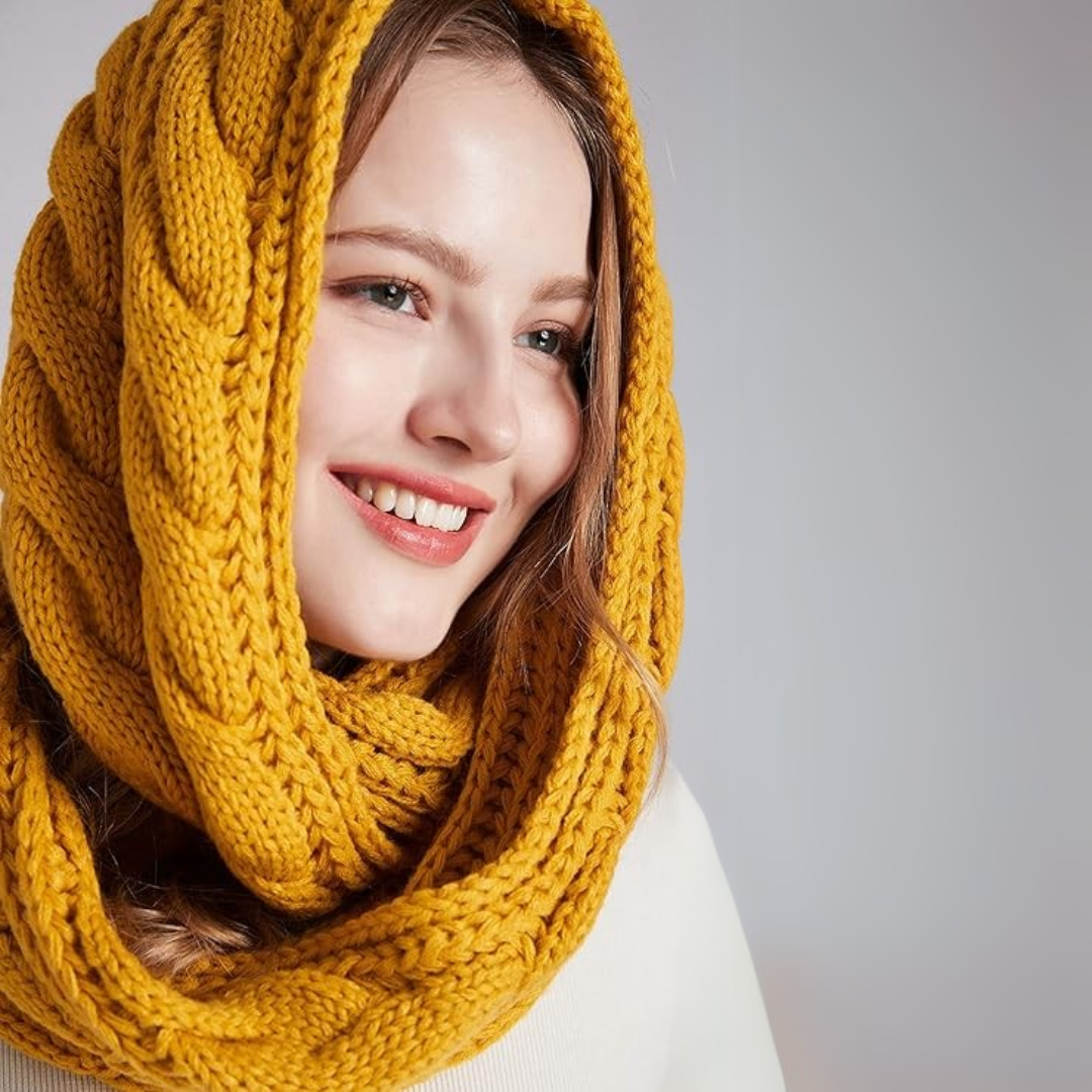 Unisex Davina ribbed knit winter scarf against a snowy background, ultimate cold protection