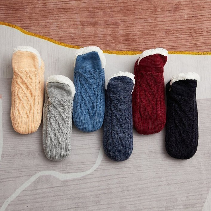 Comfortable unisex non-slip winter socks for indoor use, keeping feet warm and secure at home.