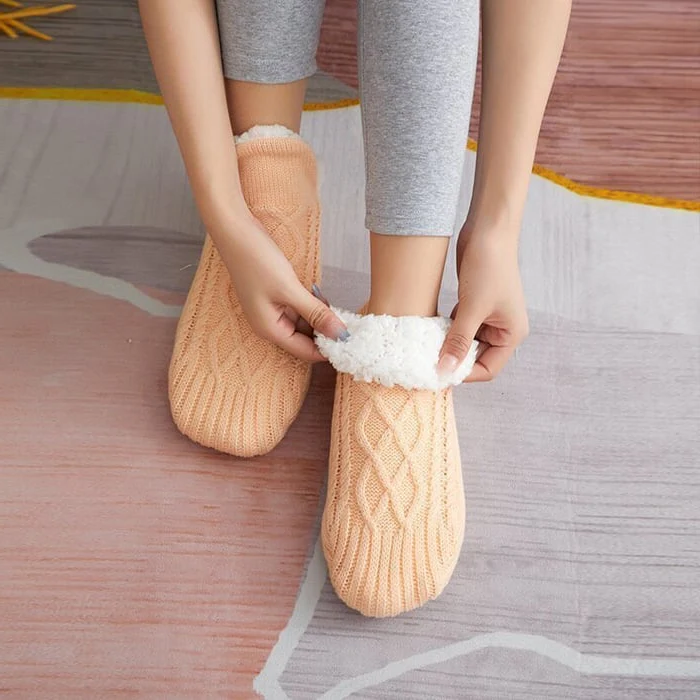 Unisex thermal house socks with non-slip soles, designed for warmth, grip, and comfort during winter.