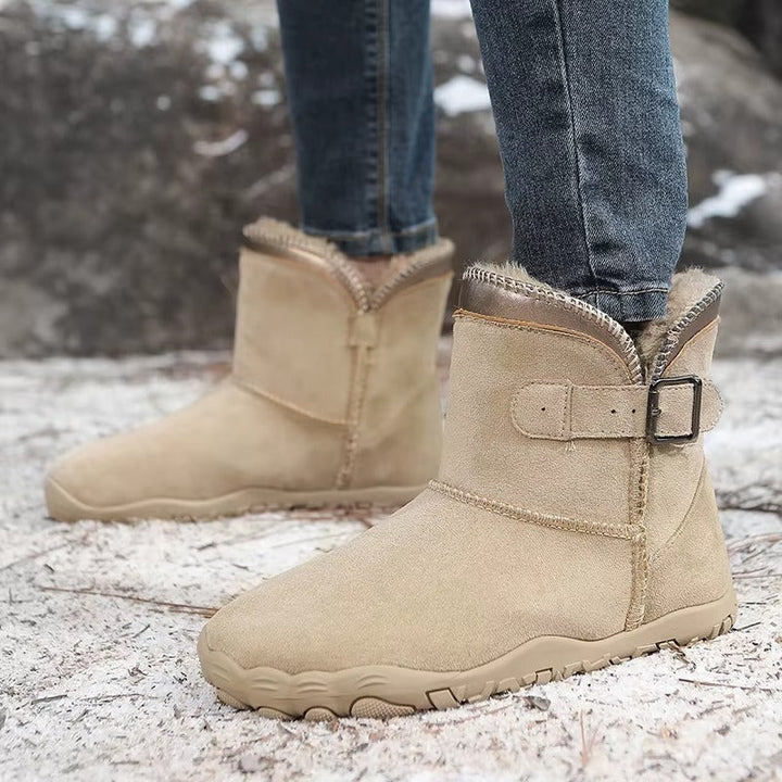 A pair of graphite grey warm winter barefoot boots, ready for cozy comfort and natural movement.